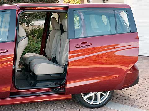 Just like a minivan, the back doors on the 2012 Mazda5 slide back instead of swinging open. It's an unusual feature on a car this size, but it makes sense for families and for people who frequently need to park in tight spaces